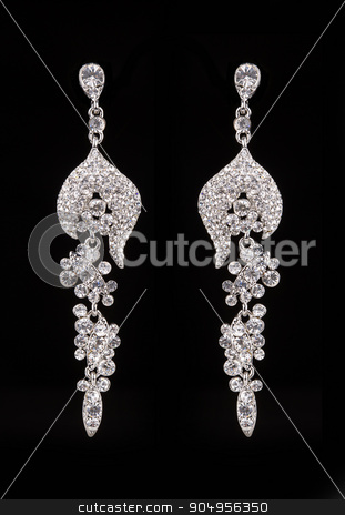 To use this stock image in your creative project, please select the size you need over to the right and click the "Add to Cart" button.
Your downloaded image will come with the Cutcaster watermark removed so don’t worry about the watermark you see on this page. earrings with jewels on the black stock photo, Silver earrings with jewels on the black by Kopytin Georgy