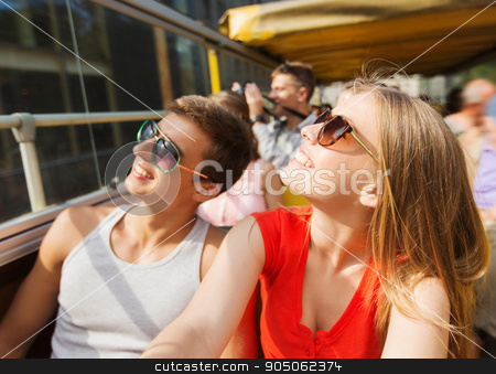 To use this stock image in your creative project, please select the size you need over to the right and click the "Add to Cart" button.
Your downloaded image will come with the Cutcaster watermark removed so don’t worry about the watermark you see on this page. happy teenage couple traveling by tour bus stock photo, travel, tourism, summer vacation, sightseeing and people concept - happy teenage couple in sunglasses traveling by tour bus by Syda Productions