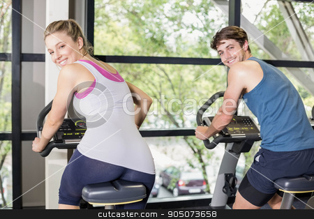 To use this stock image in your creative project, please select the size you need over to the right and click the "Add to Cart" button.
Your downloaded image will come with the Cutcaster watermark removed so don’t worry about the watermark you see on this page. Fit people doing exercise bike stock photo, Fit people doing exercise bike at gym by Wavebreak Media