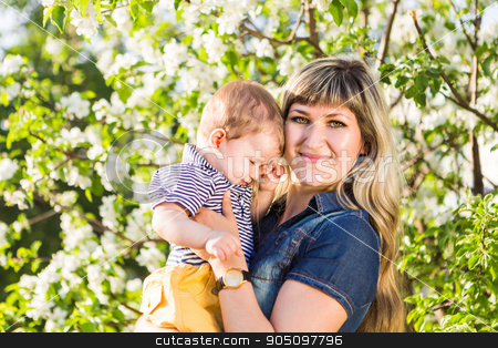 To use this stock image in your creative project, please select the size you need over to the right and click the "Add to Cart" button.
Your downloaded image will come with the Cutcaster watermark removed so don’t worry about the watermark you see on this page. Happy woman and child in the blooming spring garden. Mothers day holiday concept stock photo, Happy woman and child in the blooming spring garden.Child kissing woman. Mothers day holiday concept by Satura86