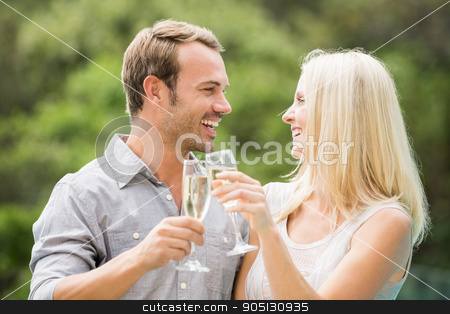 To use this stock image in your creative project, please select the size you need over to the right and click the "Add to Cart" button.
Your downloaded image will come with the Cutcaster watermark removed so don’t worry about the watermark you see on this page. Smiling couple toasting champagne flutes stock photo, Smiling couple toasting champagne flutes at resort by Wavebreak Media