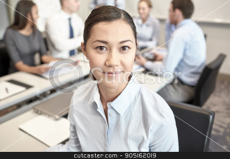 To use this stock image in your creative project, please select the size you need over to the right and click the "Add to Cart" button.
Your downloaded image will come with the Cutcaster watermark removed so don’t worry about the watermark you see on this page. group of smiling businesspeople meeting in office stock photo, business, people and teamwork concept - smiling businesswoman with group of businesspeople meeting in office by Syda Productions