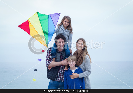 To use this stock image in your creative project, please select the size you need over to the right and click the "Add to Cart" button.
Your downloaded image will come with the Cutcaster watermark removed so don’t worry about the watermark you see on this page. Cheerful family with kite at sea shore stock photo, Portrait of cheerful family with kite at sea shore by Wavebreak Media