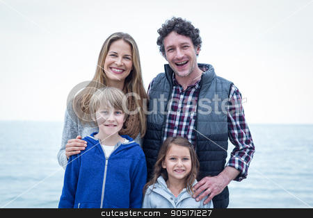 To use this stock image in your creative project, please select the size you need over to the right and click the "Add to Cart" button.
Your downloaded image will come with the Cutcaster watermark removed so don’t worry about the watermark you see on this page. Cheerful family standing at sea shore stock photo, Portrait of cheerful family standing at sea shore by Wavebreak Media