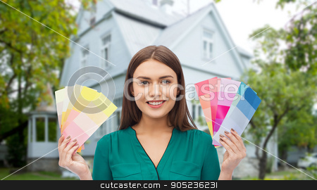 To use this stock image in your creative project, please select the size you need over to the right and click the "Add to Cart" button.
Your downloaded image will come with the Cutcaster watermark removed so don’t worry about the watermark you see on this page. smiling young woman with color swatches stock photo, repair, renovation, decoration, design and people concept - smiling young woman with color swatches or samples over home background by Syda Productions