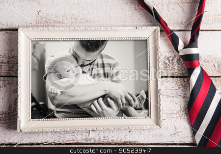 To use this stock image in your creative project, please select the size you need over to the right and click the "Add to Cart" button.
Your downloaded image will come with the Cutcaster watermark removed so don’t worry about the watermark you see on this page. Fathers day composition. Picture frame, photo, tie. Wooden backg stock photo, Fathers day composition. Black and white picture of father and daugter in picture frame, colorful tie. Wooden background. Studio shot on wooden background by HalfPoint