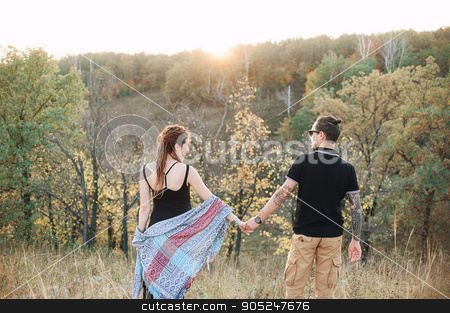 To use this stock image in your creative project, please select the size you need over to the right and click the "Add to Cart" button.
Your downloaded image will come with the Cutcaster watermark removed so don’t worry about the watermark you see on this page. man and pregnant woman hugging holding hands on the background of wild nature, autumn. love story stock photo, man in a black T-shirt and a pregnant woman in a black dress and dreadlocks embrace and are kept in hand, against the background of wild nature, autumn. love story by alexsfoto