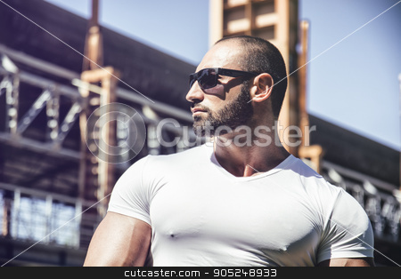 To use this stock image in your creative project, please select the size you need over to the right and click the "Add to Cart" button.
Your downloaded image will come with the Cutcaster watermark removed so don’t worry about the watermark you see on this page. Handsome muscular man standing in city setting stock photo, Handsome muscular blond man standing in city setting or former industrial environment by Stefano Cavoretto