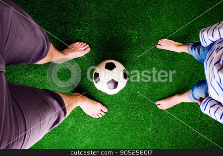 To use this stock image in your creative project, please select the size you need over to the right and click the "Add to Cart" button.
Your downloaded image will come with the Cutcaster watermark removed so don’t worry about the watermark you see on this page. Father and son with soccer ball against green grass stock photo, Legs of unrecognizable father and son with soccer ball, against artificial grass. Studio shot on green background by HalfPoint