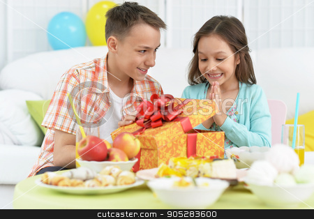 To use this stock image in your creative project, please select the size you need over to the right and click the "Add to Cart" button.
Your downloaded image will come with the Cutcaster watermark removed so don’t worry about the watermark you see on this page. Happy children with cake stock photo, Happy children with cake and gift at birthday party by Ruslan Huzau