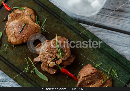 To use this stock image in your creative project, please select the size you need over to the right and click the "Add to Cart" button.
Your downloaded image will come with the Cutcaster watermark removed so don’t worry about the watermark you see on this page. Cooked meat on a tray. stock photo, Cooked meat on a tray. Meat with chili pepper. Delicious veal medallions. Incredible taste of european cuisine. by Denys