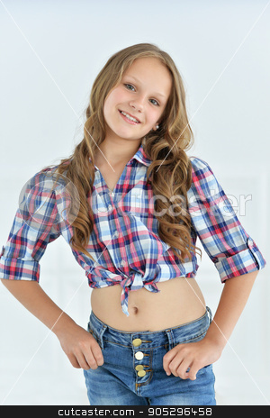 To use this stock image in your creative project, please select the size you need over to the right and click the "Add to Cart" button.
Your downloaded image will come with the Cutcaster watermark removed so don’t worry about the watermark you see on this page. cute little girl posing stock photo, cute little girl posing in shirt and jeans in studio by Ruslan Huzau
