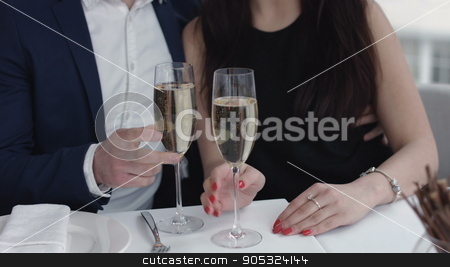 To use this stock image in your creative project, please select the size you need over to the right and click the "Add to Cart" button.
Your downloaded image will come with the Cutcaster watermark removed so don’t worry about the watermark you see on this page. Couple toasting with champagne in the restaurant stock photo, Couple toasting with champagne in the restaurant by mykhalets