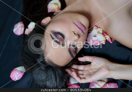 To use this stock image in your creative project, please select the size you need over to the right and click the "Add to Cart" button.
Your downloaded image will come with the Cutcaster watermark removed so don’t worry about the watermark you see on this page. Portrait of a beautiful young woman laying on sparse rose petals stock photo, Portrait of a beautiful young woman laying on sparse rose petals by timonko