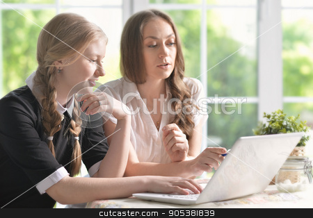 To use this stock image in your creative project, please select the size you need over to the right and click the "Add to Cart" button.
Your downloaded image will come with the Cutcaster watermark removed so don’t worry about the watermark you see on this page. mother and daughter with laptop stock photo, portrait of mother and daughter with laptop at home by Ruslan Huzau