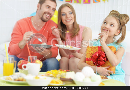 To use this stock image in your creative project, please select the size you need over to the right and click the "Add to Cart" button.
Your downloaded image will come with the Cutcaster watermark removed so don’t worry about the watermark you see on this page. parents and daughter with cake stock photo, Happy parents and daughter with cake at birthday party by Ruslan Huzau