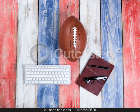 To use this stock image in your creative project, please select the size you need over to the right and click the "Add to Cart" button.
Your downloaded image will come with the Cutcaster watermark removed so don’t worry about the watermark you see on this page. Analyzing American football for the season on rustic boards pain stock photo, Overhead view of computer keyboard, reading glasses, notepad, pen and American football on red, white and blue rustic wooden boards. Concept of draft day and future plays for the season. by tab62