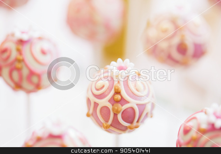 To use this stock image in your creative project, please select the size you need over to the right and click the "Add to Cart" button.
Your downloaded image will come with the Cutcaster watermark removed so don’t worry about the watermark you see on this page. close up of cake pops or lollipops stock photo, food, sweets, junk-food, confectionery and eating concept - close up of cake pops or lollipops by Syda Productions