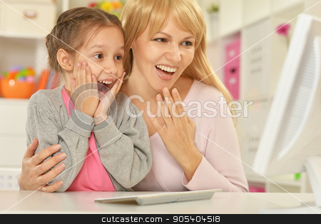 To use this stock image in your creative project, please select the size you need over to the right and click the "Add to Cart" button.
Your downloaded image will come with the Cutcaster watermark removed so don’t worry about the watermark you see on this page. mother and daughter with computer stock photo, portrait of mother and daughter with computer at home by Ruslan Huzau