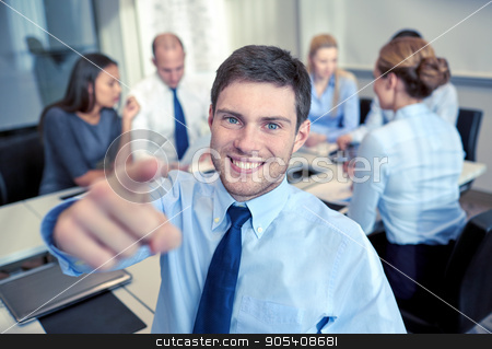To use this stock image in your creative project, please select the size you need over to the right and click the "Add to Cart" button.
Your downloaded image will come with the Cutcaster watermark removed so don’t worry about the watermark you see on this page. group of smiling businesspeople meeting in office stock photo, business, people, gesture and teamwork concept - smiling businessman pointing finger to you with group of businesspeople meeting in office by Syda Productions