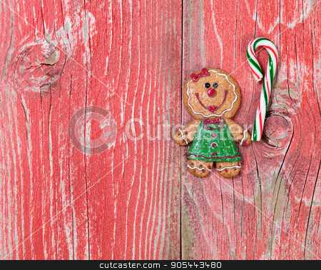 To use this stock image in your creative project, please select the size you need over to the right and click the "Add to Cart" button.
Your downloaded image will come with the Cutcaster watermark removed so don’t worry about the watermark you see on this page. Gingerbread cookie and candy cane on rustic red wooden boards stock photo, Christmas holiday cookie and candy cane on rustic red wood. by tab62