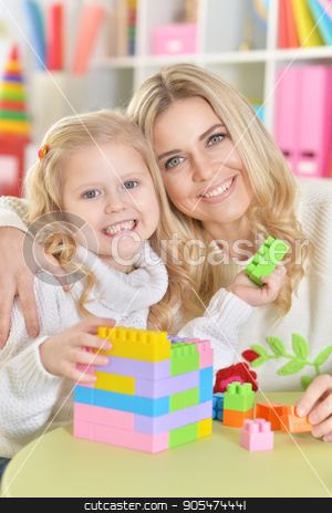 To use this stock image in your creative project, please select the size you need over to the right and click the "Add to Cart" button.
Your downloaded image will come with the Cutcaster watermark removed so don’t worry about the watermark you see on this page. mother with little daughter stock photo, mother with little daughter making figures with constructor by Ruslan Huzau