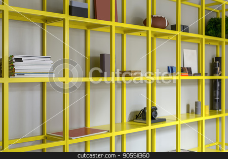 To use this stock image in your creative project, please select the size you need over to the right and click the "Add to Cart" button.
Your downloaded image will come with the Cutcaster watermark removed so don’t worry about the watermark you see on this page. Yellow shelves with accessories stock photo, Metal yellow shelves with magazines, some books, photo camera, plant and other accessories. Closeup. Horizontal by bezikus