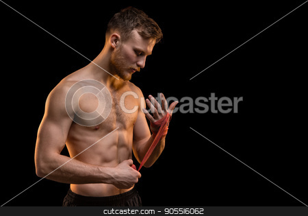 To use this stock image in your creative project, please select the size you need over to the right and click the "Add to Cart" button.
Your downloaded image will come with the Cutcaster watermark removed so don’t worry about the watermark you see on this page. Bearded fighter man with boxing bandages stock photo, Bearded fighter man with boxing bandages on black background by Chris Tefme