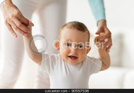 To use this stock image in your creative project, please select the size you need over to the right and click the "Add to Cart" button.
Your downloaded image will come with the Cutcaster watermark removed so don’t worry about the watermark you see on this page. happy baby learning to walk with mother help stock photo, family, child, childhood and parenthood concept - happy little baby learning to walk with mother help at home by Syda Productions