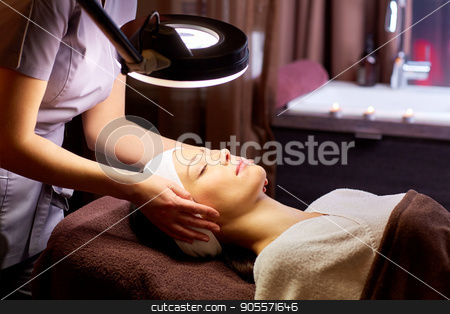 To use this stock image in your creative project, please select the size you need over to the right and click the "Add to Cart" button.
Your downloaded image will come with the Cutcaster watermark removed so don’t worry about the watermark you see on this page. beautician doing face massage to woman at spa stock photo, people, beauty, lifestyle and relaxation concept - beautician with magnifying lamp doing face massage to beautiful young woman at spa by Syda Productions