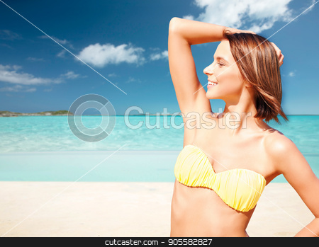 To use this stock image in your creative project, please select the size you need over to the right and click the "Add to Cart" button.
Your downloaded image will come with the Cutcaster watermark removed so don’t worry about the watermark you see on this page. happy woman in bikini swimsuit on tropical beach stock photo, people, summer holidays, vacation and travel concept - happy young woman posing in bikini swimsuit with raised hand over exotic tropical beach background by Syda Productions