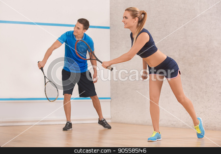 To use this stock image in your creative project, please select the size you need over to the right and click the "Add to Cart" button.
Your downloaded image will come with the Cutcaster watermark removed so don’t worry about the watermark you see on this page. Young man and woman play squash in the gym stock photo, Young man and woman squash players together game by Dmytro Sidelnikov