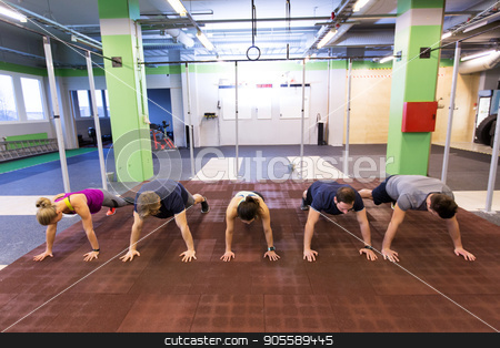To use this stock image in your creative project, please select the size you need over to the right and click the "Add to Cart" button.
Your downloaded image will come with the Cutcaster watermark removed so don’t worry about the watermark you see on this page. group of people exercising in gym stock photo, fitness, sport, exercising, training and healthy lifestyle concept - group of people doing straight arm plank in gym by Syda Productions