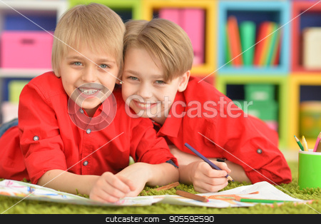 To use this stock image in your creative project, please select the size you need over to the right and click the "Add to Cart" button.
Your downloaded image will come with the Cutcaster watermark removed so don’t worry about the watermark you see on this page. Two brothers draws with pencils stock photo, Portrait of two cute brothers draws with pencils by Ruslan Huzau