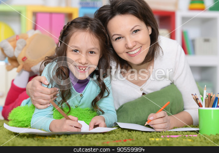 To use this stock image in your creative project, please select the size you need over to the right and click the "Add to Cart" button.
Your downloaded image will come with the Cutcaster watermark removed so don’t worry about the watermark you see on this page. Mother and daughte drawing pictures stock photo, Mother and daughter lying on floor and drawing pictures by Ruslan Huzau