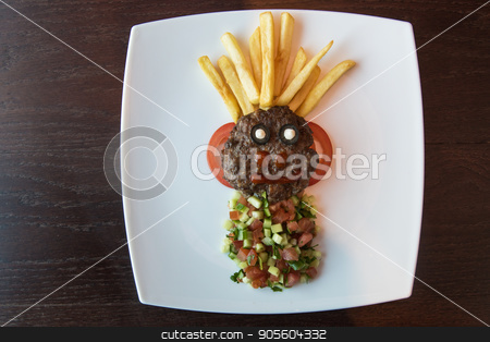 To use this stock image in your creative project, please select the size you need over to the right and click the "Add to Cart" button.
Your downloaded image will come with the Cutcaster watermark removed so don’t worry about the watermark you see on this page. Funny meat cutlet face stock photo, Funny meat cutlet face with french fries as hair and cutted vegetables for children menu by olinchuk