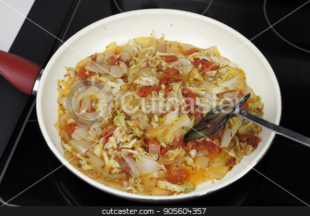 To use this stock image in your creative project, please select the size you need over to the right and click the "Add to Cart" button.
Your downloaded image will come with the Cutcaster watermark removed so don’t worry about the watermark you see on this page. Several Vegetables Cooking in a Saucepan for Dinner stock photo, Mixed white onions, napa cabbage, red tomatoes and garlic cooking in a saucepan. Savory vegetables to serve with dinner cooking in a pan on a stove. by Lee Serenethos