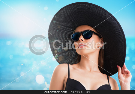 To use this stock image in your creative project, please select the size you need over to the right and click the "Add to Cart" button.
Your downloaded image will come with the Cutcaster watermark removed so don’t worry about the watermark you see on this page. Girl with hat and sunglasses at the beach stock photo, Girl with black hat and sunglasses at the beach by Federico Caputo