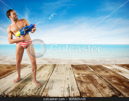 To use this stock image in your creative project, please select the size you need over to the right and click the "Add to Cart" button.
Your downloaded image will come with the Cutcaster watermark removed so don’t worry about the watermark you see on this page. Boy play with water gun stock photo, Boy play with water gun at the beach by Federico Caputo