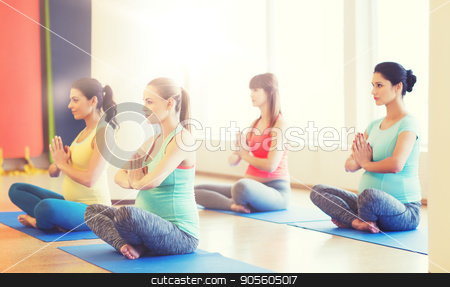 To use this stock image in your creative project, please select the size you need over to the right and click the "Add to Cart" button.
Your downloaded image will come with the Cutcaster watermark removed so don’t worry about the watermark you see on this page. happy pregnant women exercising yoga in gym stock photo, pregnancy, sport, fitness, people and healthy lifestyle concept - group of happy pregnant women exercising yoga in lotus pose in gym by Syda Productions