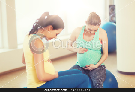 To use this stock image in your creative project, please select the size you need over to the right and click the "Add to Cart" button.
Your downloaded image will come with the Cutcaster watermark removed so don’t worry about the watermark you see on this page. two happy pregnant women sitting on balls in gym stock photo, pregnancy, sport, fitness, people and healthy lifestyle concept - two happy pregnant women sitting on balls in gym by Syda Productions