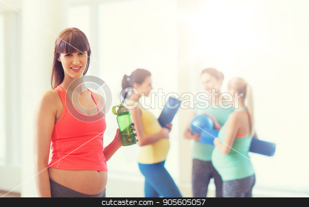 To use this stock image in your creative project, please select the size you need over to the right and click the "Add to Cart" button.
Your downloaded image will come with the Cutcaster watermark removed so don’t worry about the watermark you see on this page. happy pregnant woman with water bottle in gym stock photo, pregnancy, sport, fitness, people and healthy lifestyle concept - happy pregnant woman with water bottle in gym by Syda Productions