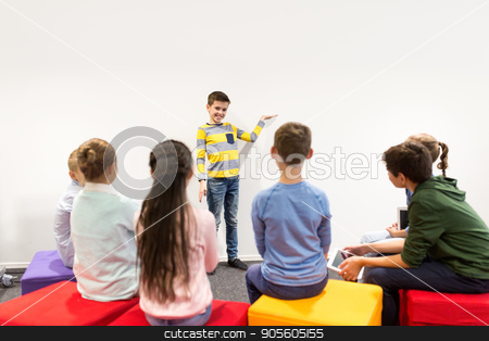 To use this stock image in your creative project, please select the size you need over to the right and click the "Add to Cart" button.
Your downloaded image will come with the Cutcaster watermark removed so don’t worry about the watermark you see on this page. happy student boy showing something at white wall stock photo, education, elementary school, learning and people concept - happy student boy showing something at white wall by Syda Productions