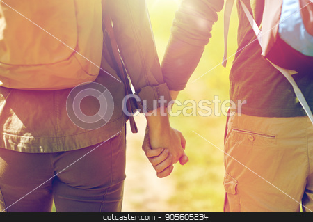 To use this stock image in your creative project, please select the size you need over to the right and click the "Add to Cart" button.
Your downloaded image will come with the Cutcaster watermark removed so don’t worry about the watermark you see on this page. close up of couple with backpacks holding hands stock photo, travel, hiking, backpacking, tourism and people concept - close up of couple with backpacks holding hands and walking along country road by Syda Productions