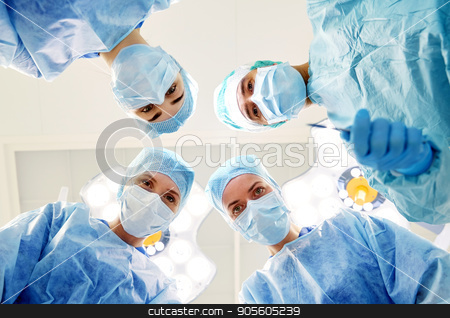 To use this stock image in your creative project, please select the size you need over to the right and click the "Add to Cart" button.
Your downloaded image will come with the Cutcaster watermark removed so don’t worry about the watermark you see on this page. group of surgeons in operating room at hospital stock photo, surgery, medicine and people concept - group of surgeons in operating room at hospital looking into camera by Syda Productions