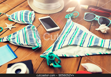 To use this stock image in your creative project, please select the size you need over to the right and click the "Add to Cart" button.
Your downloaded image will come with the Cutcaster watermark removed so don’t worry about the watermark you see on this page. close up of smartphone and beach stuff stock photo, vacation, travel, tourism, technology and objects concept - close up of smartphone and beach stuff by Syda Productions