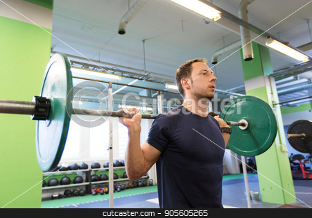 To use this stock image in your creative project, please select the size you need over to the right and click the "Add to Cart" button.
Your downloaded image will come with the Cutcaster watermark removed so don’t worry about the watermark you see on this page. man doing exercise with barbell in gym stock photo, sport, fitness and people concept - smiling man doing exercise with barbell in gym by Syda Productions