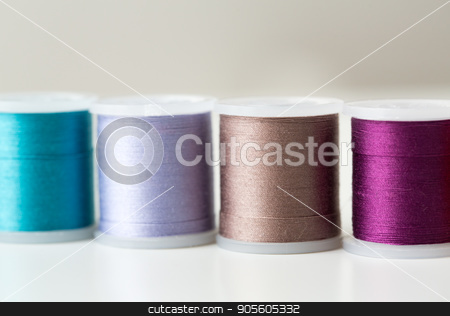 To use this stock image in your creative project, please select the size you need over to the right and click the "Add to Cart" button.
Your downloaded image will come with the Cutcaster watermark removed so don’t worry about the watermark you see on this page. row of colorful thread spools on table stock photo, needlework, craft, sewing and tailoring concept - row of colorful thread spools on table by Syda Productions