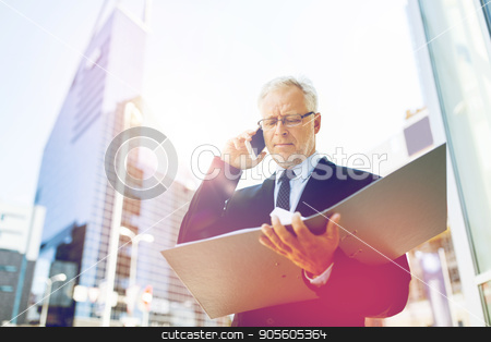 To use this stock image in your creative project, please select the size you need over to the right and click the "Add to Cart" button.
Your downloaded image will come with the Cutcaster watermark removed so don’t worry about the watermark you see on this page. senior businessman calling on smartphone in city stock photo, business, technology, communication and people concept - senior businessman with document folder calling on smartphone in city by Syda Productions