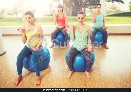 To use this stock image in your creative project, please select the size you need over to the right and click the "Add to Cart" button.
Your downloaded image will come with the Cutcaster watermark removed so don’t worry about the watermark you see on this page. happy pregnant women exercising on fitball in gym stock photo, pregnancy, sport, fitness, people and healthy lifestyle concept - group of happy pregnant women with dumbbells exercising on ball in gym by Syda Productions